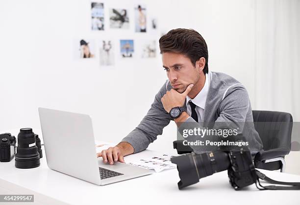 finding the right image for his project - beauty editor stock pictures, royalty-free photos & images
