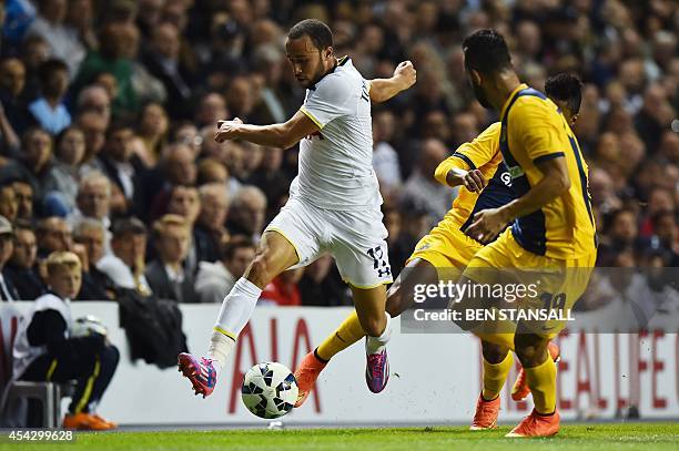 Tottenham Hotspur's English midfielder Andros Townsend runs against AEL Limassol's Brazilian defender Edmar during the UEFA Europa League qualifying...