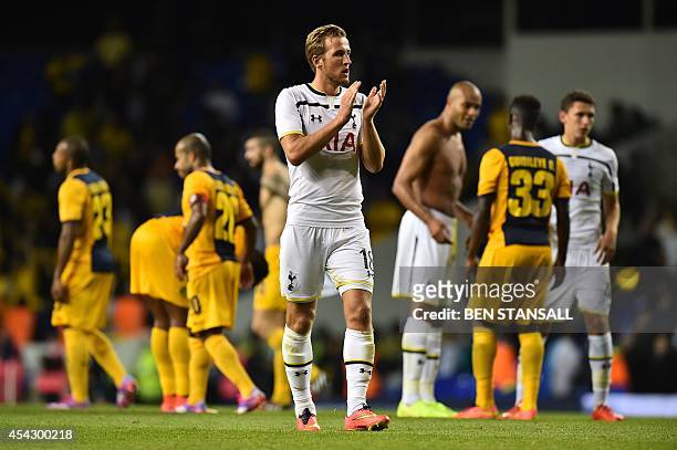 Tottenham Hotspur's English striker Harry Kane applauds after the final whistle during the UEFA Europa League qualifying round play-off second-leg...