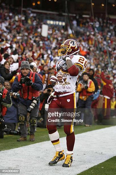 Washington Redskins Clinton Portis victorious, pointing to Sean Taylor memorial t-shirt after scoring touchdown vs Buffalo Bills at FedEx Field....