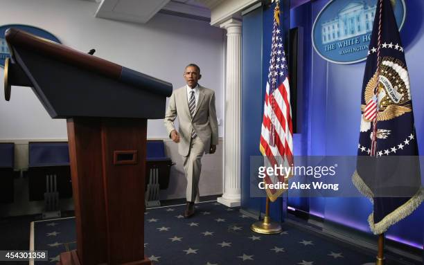 President Barack Obama approaches the podium to make a statement at the James Brady Press Briefing Room of the White House August 28, 2014 in...
