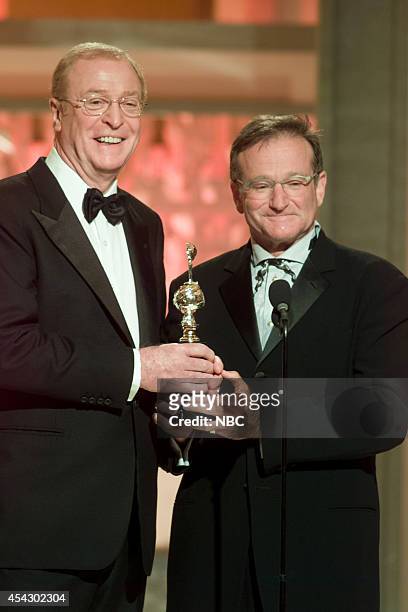Pictured: Michael Caine and Robin Williams speak on stage at the 60th Annual Golden Globe Awards held at the Beverly Hilton Hotel on January 19, 2003...