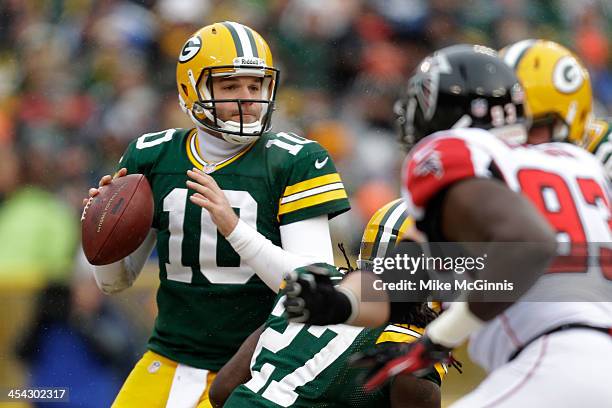 Matt Flynn of the Green Bay Packers drops back to pass the football during the first half of play against the Atlanta Falcons at Lambeau Field on...