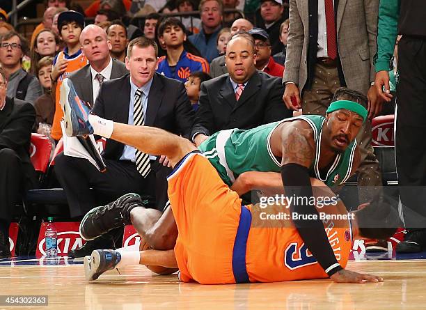 Gerald Wallace of the Boston Celtics gets wrapped up with Pablo Prigioni of the New York Knicks at Madison Square Garden on December 8, 2013 in New...