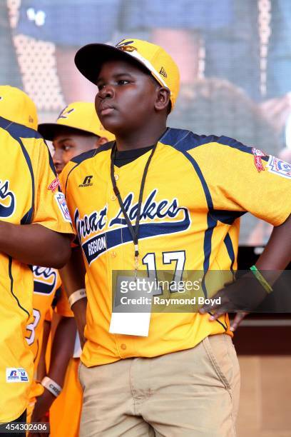 Jackie Robinson West little league baseball player Josh Houston acknowledges the crowd during the team's United States World Series Championship...