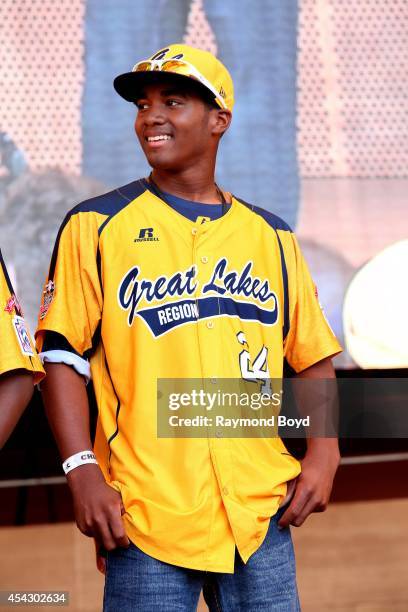 Jackie Robinson West little league baseball player Trey Hondras acknowledges the crowd during the team's United States World Series Championship...