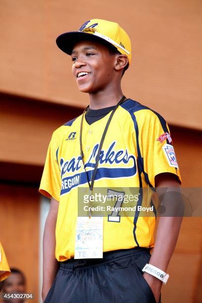 Jackie Robinson West little league baseball player Lawrence Noble acknowledges the crowd during the team's United States World Series Championship...