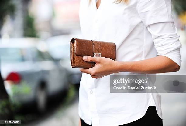 Owner of Lions Model Agency Madisyn Ritland is seen around Soho wearing Rag and Bone shirt, Acne pants with a Gucci clutch on August 28, 2014 in New...
