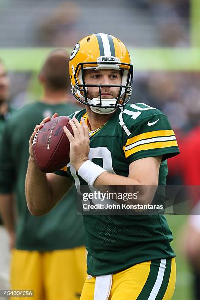 Quarterback Matt Flynn of the Green Bay Packers warms up before the preseason game against the Kansas City Chiefs on August 28, 2014 at Lambeau Field...