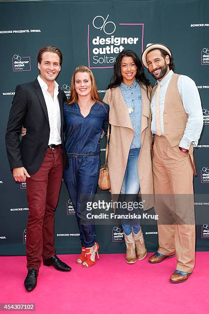 Alexander Klaws, Nadja Scheiwiller, Rebecca Mir and Massimo Sinato attend the Late Night Shopping Designer Outlet Soltau on August 28, 2014 in...