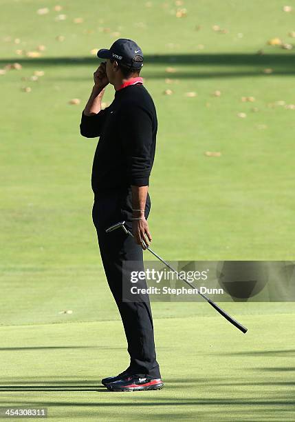 Tiger Woods reacts after missing his birdie putt attempt on the fourth hole during the final round of the Northwestern Mutual World Challenge at...