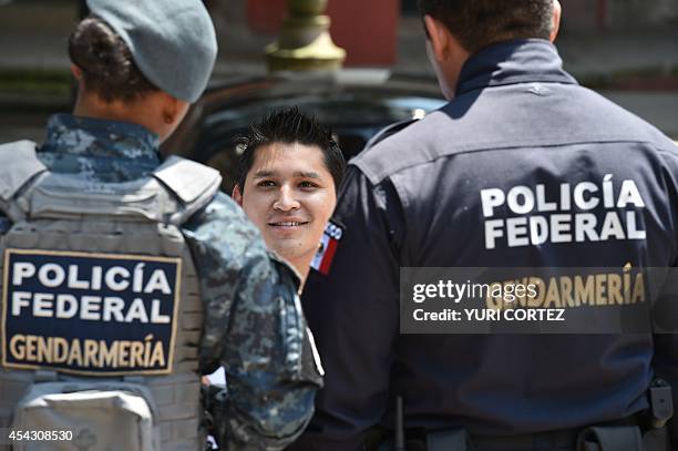 Members of the Mexican National Gendarmerie, a new group of the Federal Police, stand guard during a joint patrolling with the Mexican Federal...