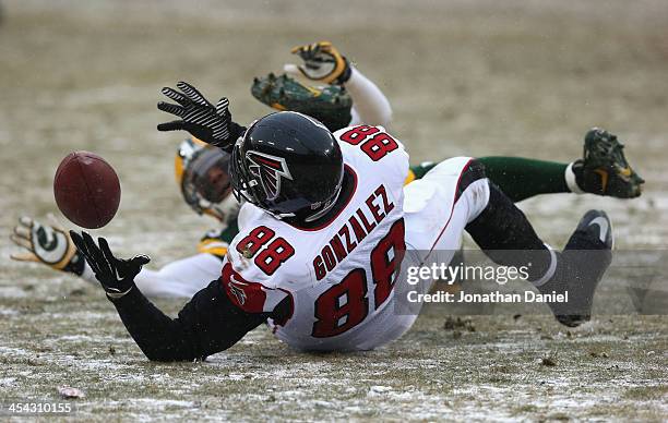 Tony Gonzalez of the Atlanta Falcons can't hold on to the ball on a 4th down play against the Green Bay Packers at Lambeau Field on December 8, 2013...
