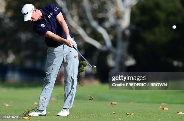 Golfer Webb Simpson plays a shot to the green at the fifth hole during the final round of the Northwestern Mutual World Challenge golf tournament at...