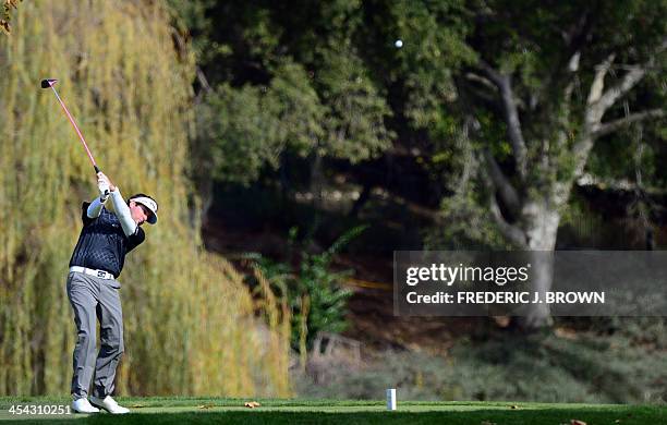 Golfer Bubba Watson plays a shot to the green at the fifth hole during the final round of the Northwestern Mutual World Challenge golf tournament at...