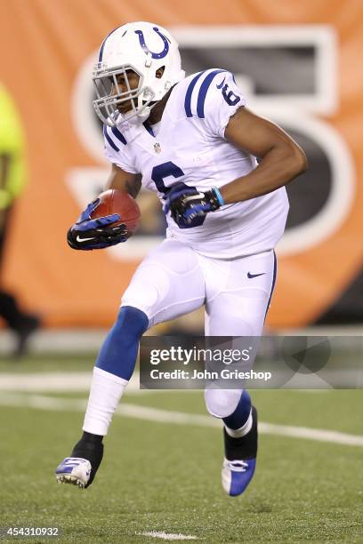 Loucheiz Purifoy of the Indianapolis Colts carries the ball during the third quarter against the Indianapolis Colts at Paul Brown Stadium on August...