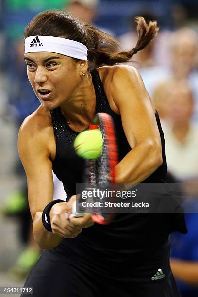 Sorana Cirstea of Romania returns a shot against Eugenie Bouchard of Canada on Day Four of the 2014 US Open at the USTA Billie Jean King National...