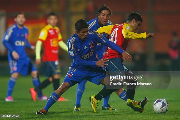 Jose Ramon Fernandez of U de Chile fights for the ball with Cristian Chavez of Union Española during a match between Unión Española and U de Chile as...