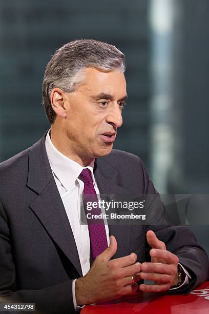 Frank Appel, chief executive officer of Deutsche Post AG, gestures while he speaks during a Bloomberg Television interview in Hong Kong, China, on...