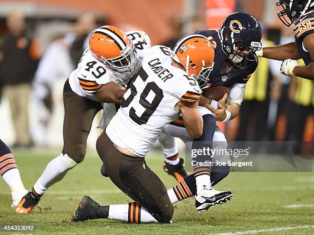 Jamaal Westerman and Tank Carder of the Cleveland Browns sack David Fales of the Chicago Bears during the fourth quarter at FirstEnergy Stadium on...