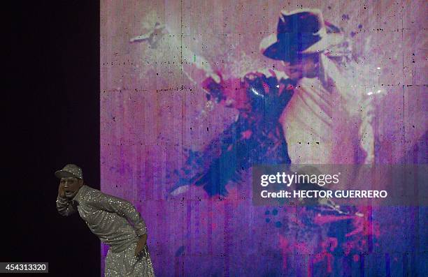 Cirque du Soleil dancers and actors perform during 'Michael Jackson: The Immortal World Tour' on August 28, 2014 in Guadalajara city, Mexico. After...