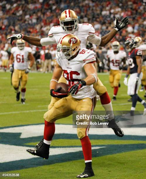 Kyle Nelson of the San Francisco 49ers celebrates with Lance Lewis after scoring on a two yard pass in the fourth quarter against the Houston Texans...