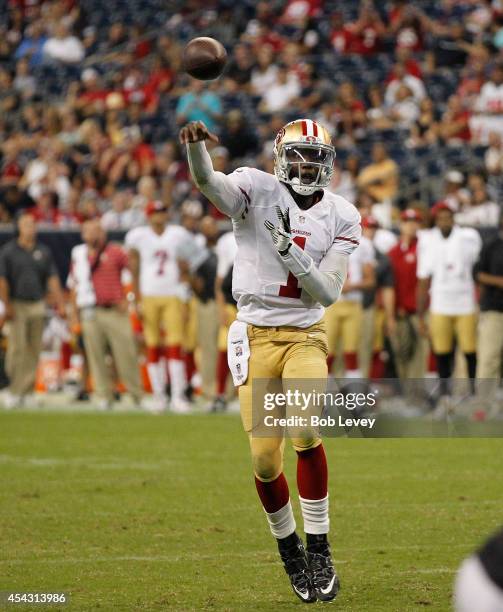 Josh Johnson of the San Francisco 49ers throws a two yard pass for a touchdown in the fourth quarter against the Houston Texans at Reliant Stadium on...