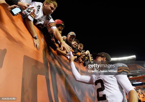 Johnny Manziel of the Cleveland Browns acknowledges fans after the game against the Chicago Bears at FirstEnergy Stadium on August 28, 2014 in...
