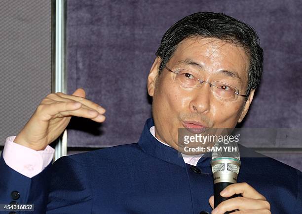 Chang An-lo also known as the "White Wolf" speaks during a press conference in Taipei on August 29, 2014. Chang, a pro-China activist also known as...