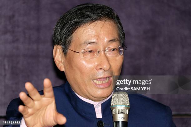 Chang An-lo also known as the "White Wolf" speaks during a press conference in Taipei on August 29, 2014. Chang, a pro-China activist also known as...