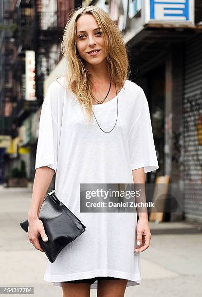 Esthetician Nichelle Welch is seen around Nolita wearing a Black Denim shirt, 100 shorts and a Proenza Schouler clutch on August 28, 2014 in New York...