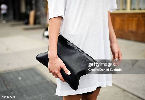 Esthetician Nichelle Welch is seen around Nolita wearing a Black Denim shirt, 100 shorts and a Proenza Schouler clutch on August 28, 2014 in New York...