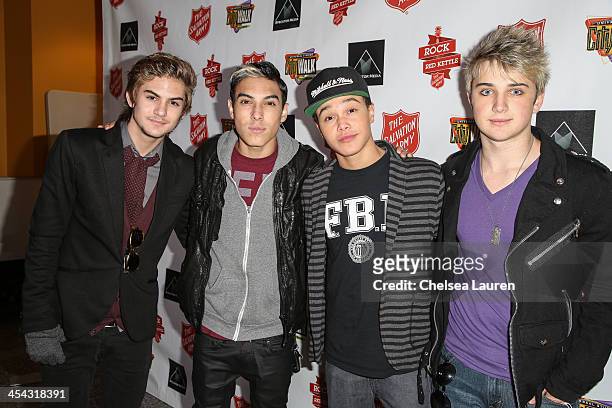 Singers Cole Pendery, Gabe Morales, Dana Vaughns and Dalton Rappatoni of IM5 arrive at The Salvation Army's 4th annual Rock The Red Kettle concert at...