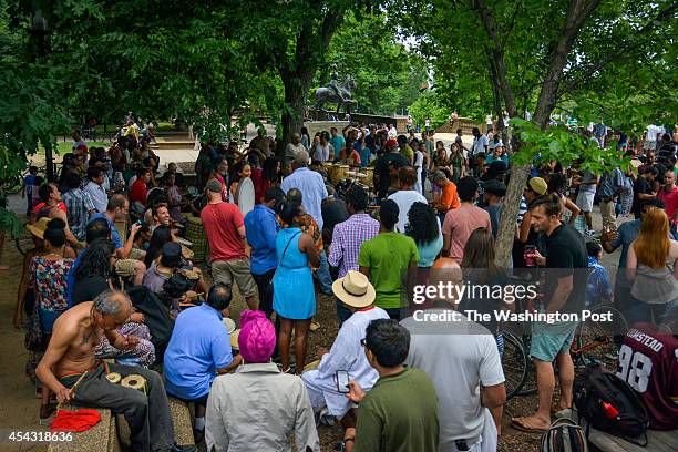 Crowd gathers around the Summer season's weekly Sunday drum circle at Meridian Hill Park on Sunday, June 8 in Washington, DC. The circle is said to...