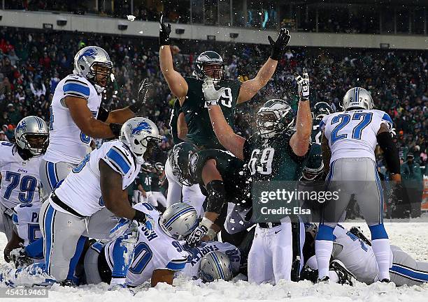 Evan Mathis and Todd Herremans of the Philadelphia Eagles celebrate a touchdown in the fourth quarter against the Detroit Lions on December 8, 2013...