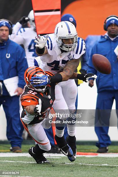 Chris Crocker of the Cincinnati Bengals battles for the ball with Weslye Saunders of the Indianapolis Colts during their game at Paul Brown Stadium...