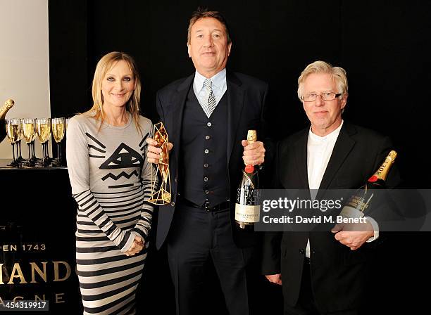 Steven Knight , winner of the Best Screenplay award for "Locke", poses with presenters Lesley Sharp and Phil Davis pose backstage at the Moet British...