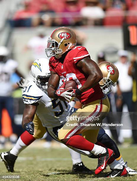 Alfonso Smith of the San Francisco 49ers carries the ball against the San Diego Chargers during the fourth quarter of a preseason game on August 24,...