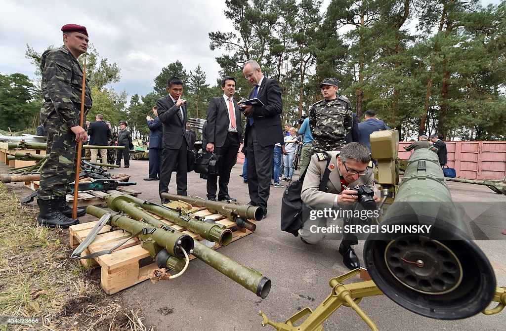 Cache Ukraine Military attaches examine a Russian weapons cache displayed in Kiev ...