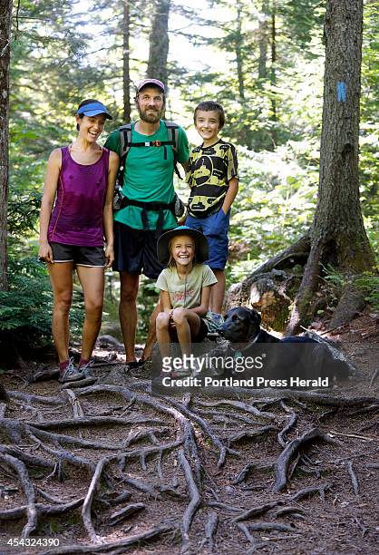 The Kallin family, Dave and Emily, their children Nathan and Madeline and their dog Orion, pause for a family portrait near Gulf Hagas, a registered...
