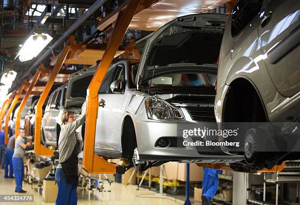 Nissan, Renault and Lada automobiles move along the assembly line at the OAO AvtoVAZ plant, controlled by Renault SA and Nissan Motor Co., in...