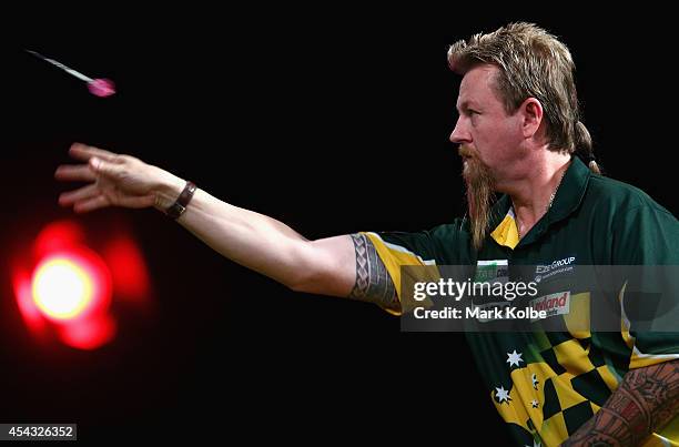 Simon Whitlock of Australia competes during in his quarter-final match against Kyle Anderson of Australia during the Sydney Darts Masters at Hordern...