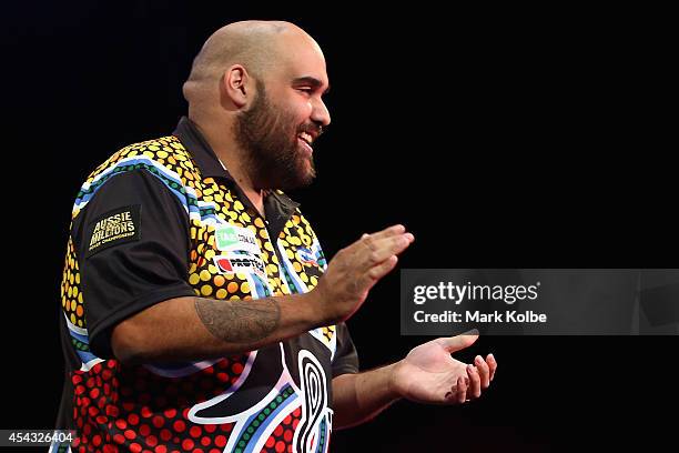 Kyle Anderson of Australia celebrates victory in his quarter-final match against Simon Whitlock of Australia during the Sydney Darts Masters at...