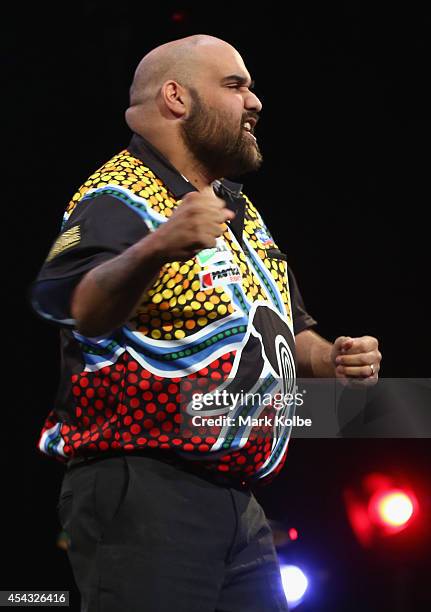Kyle Anderson of Australia celebrates victory in his quarter-final match against Simon Whitlock of Australia during the Sydney Darts Masters at...