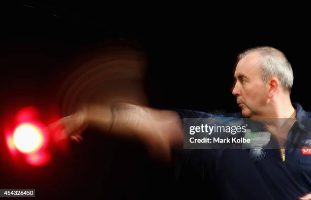 Phil Taylor of England competes in his quarter-final match against Dave Chisnall of England during the Sydney Darts Masters at Hordern Pavilion on...