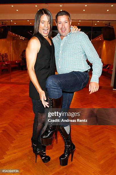 Jorge Gonzalez and Joachim Llambi pose together in high heel shoes during the IN Magazin Dance Club event at dancing school Reichelt on August 28,...