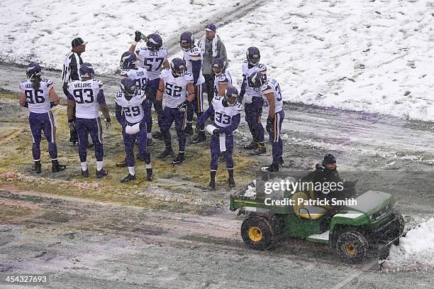 Strong safety Jamarca Sanford of the Minnesota Vikings looks on as the field is cleared of snow against the Baltimore Ravens in the second quarter at...