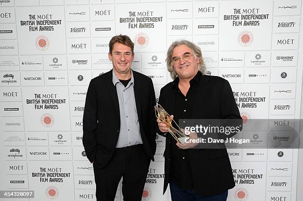 Tim Bevan and Paul Greengrass winner of the Variety Award attends the Moet British Independent Film Awards 2013 at Old Billingsgate Market on...