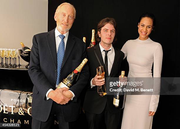 Paul Wright , winner of the Douglas Hickox Award for "For Those In Peril", poses with presenters Charles Dance and Zawe Ashton backstage at the Moet...