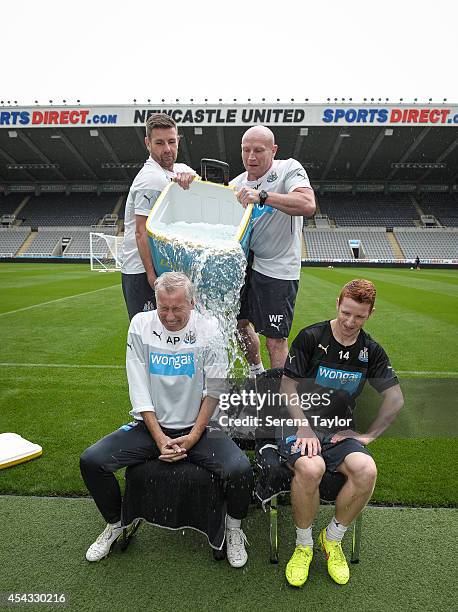 Newcastle Manager Alan Pardew participates in the ASL Ice Bucket Challenge with help from Masseurs Mick Holland and Wayne Farrage , also seen is Jack...